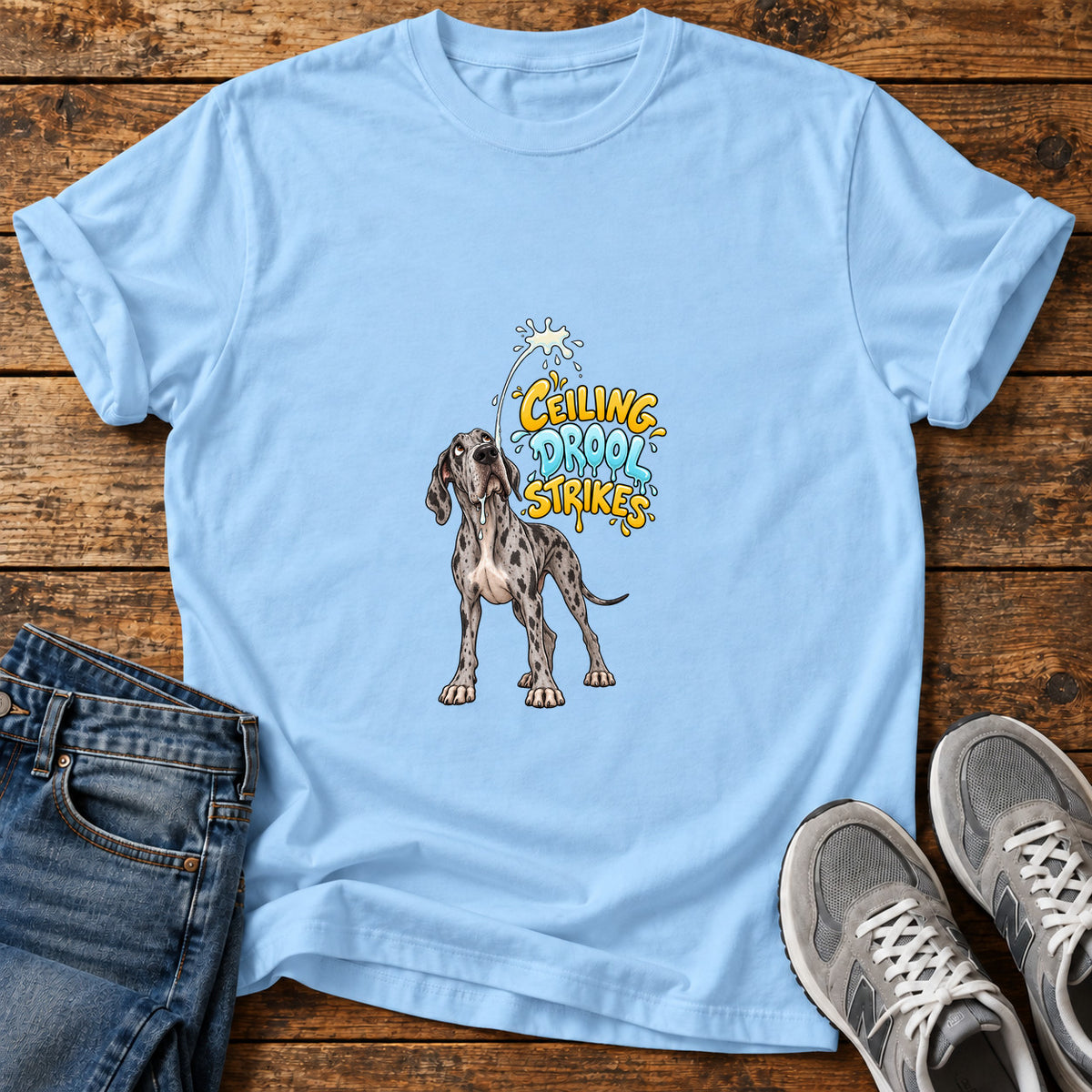 Ceiling Drool Strikes Great Dane graphic T-shirt in Light Blue, shown on a flat-lay shirt mockup