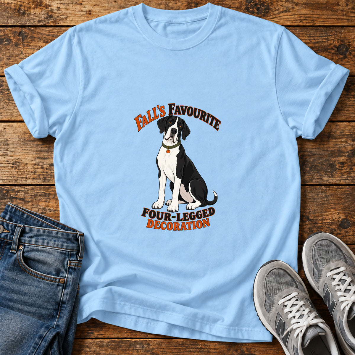 Fall's Favourite Pup Great Dane graphic T-shirt in Light Blue, shown on a flat-lay shirt mockup