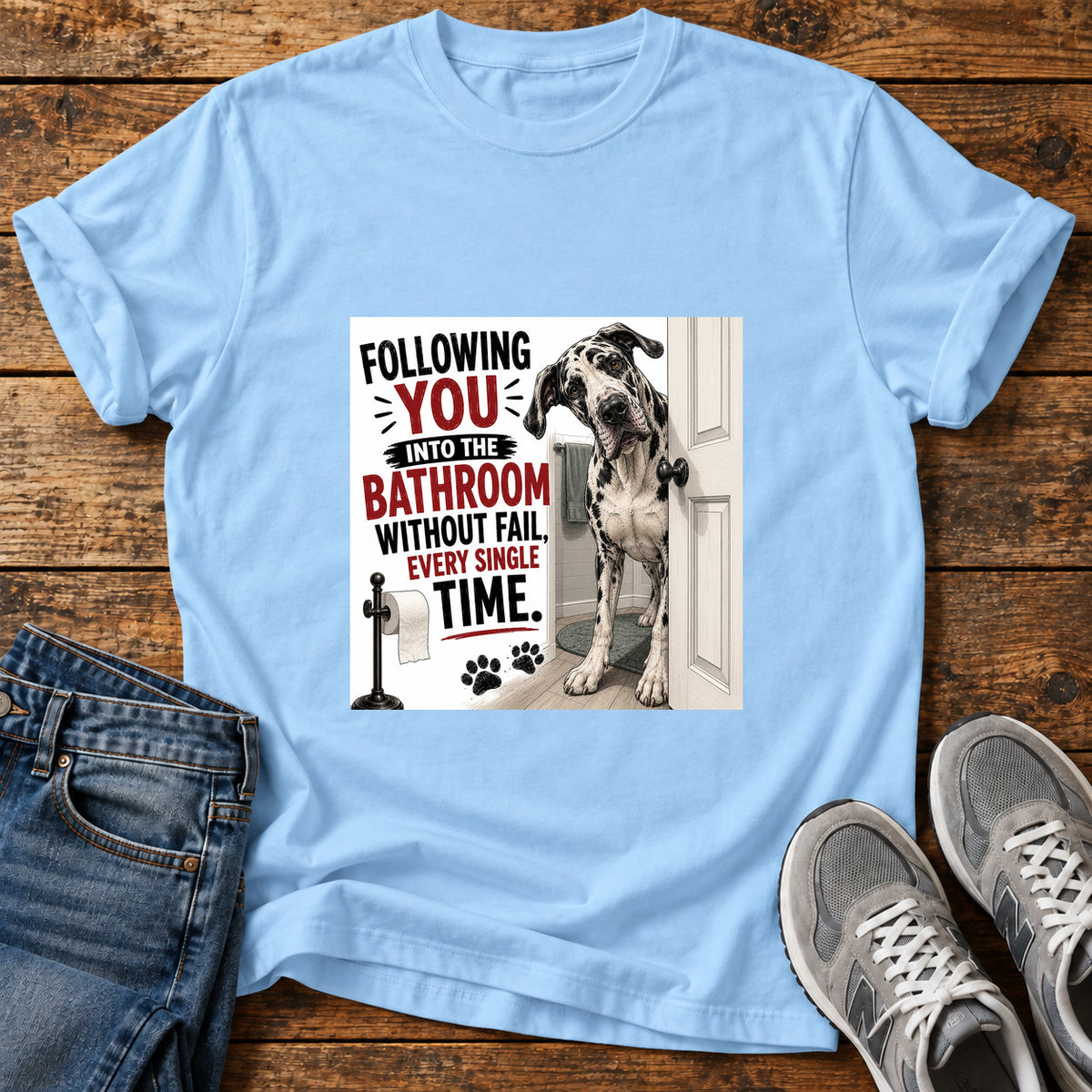 Bathroom Shadow Great Dane graphic T-shirt in Light Blue, shown on a flat-lay shirt mockup