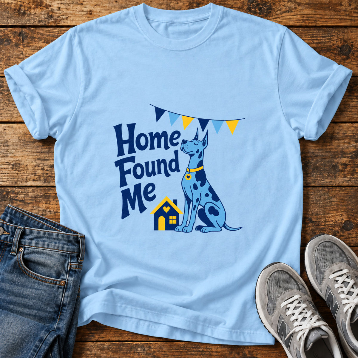 Home Found Me Great Dane graphic T-shirt in Light Blue, shown on a flat-lay shirt mockup