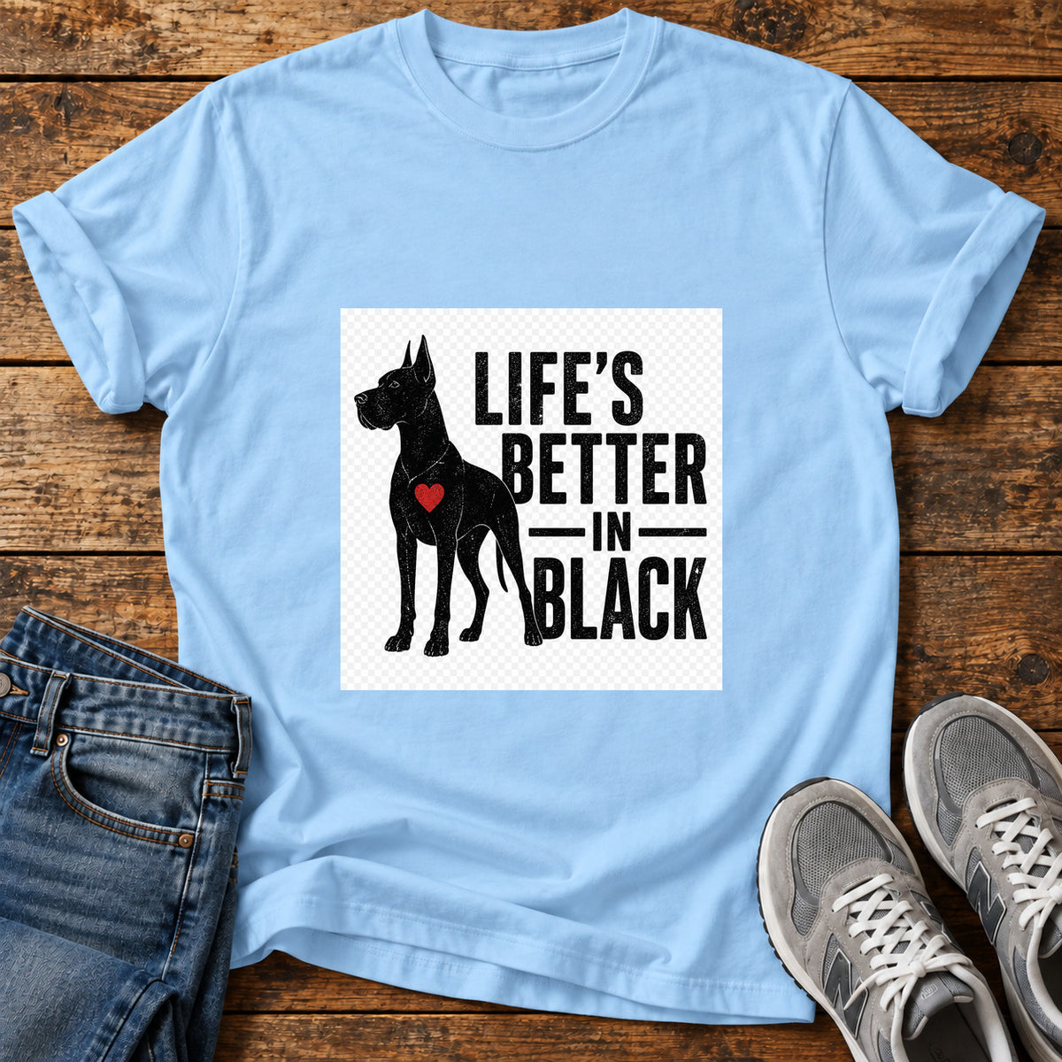 Life's Better Black Great Dane graphic T-shirt in Light Blue, shown on a flat-lay shirt mockup
