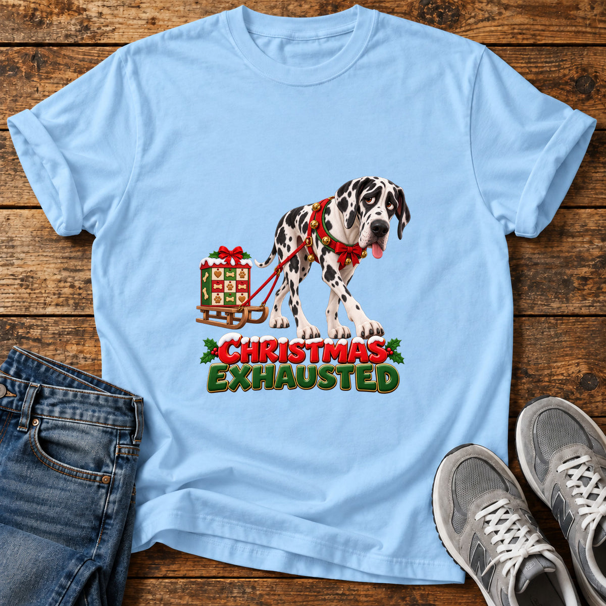 Christmas Exhausted Great Dane graphic T-shirt in Light Blue, shown on a flat-lay shirt mockup