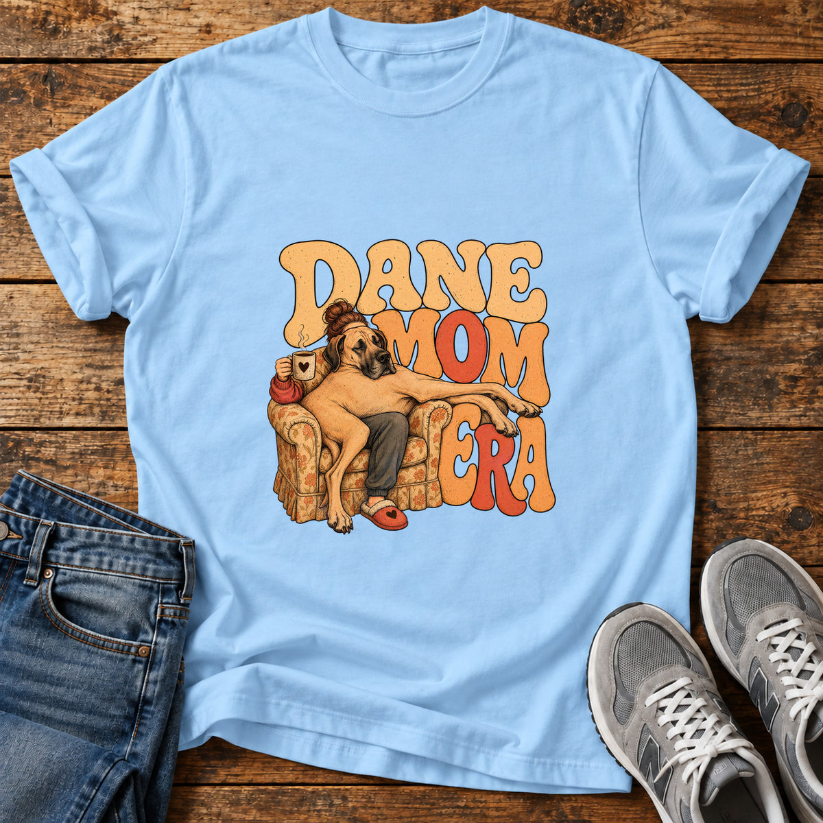Dane Mom Era Great Dane graphic T-shirt in Light Blue, shown on a flat-lay shirt mockup