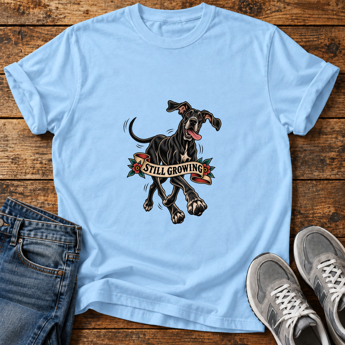 Still Growing Great Dane graphic T-shirt in Light Blue, shown on a flat-lay shirt mockup