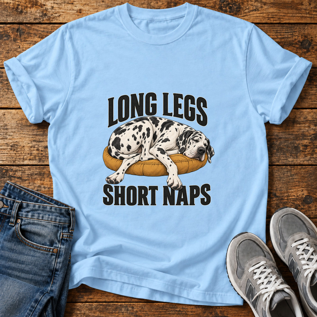 Long Legs Naps Great Dane graphic T-shirt in Light Blue, shown on a flat-lay shirt mockup