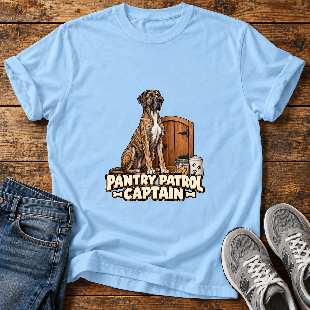 Pantry Patrol Captain Great Dane graphic T-shirt in Light Blue, shown on a flat-lay shirt mockup