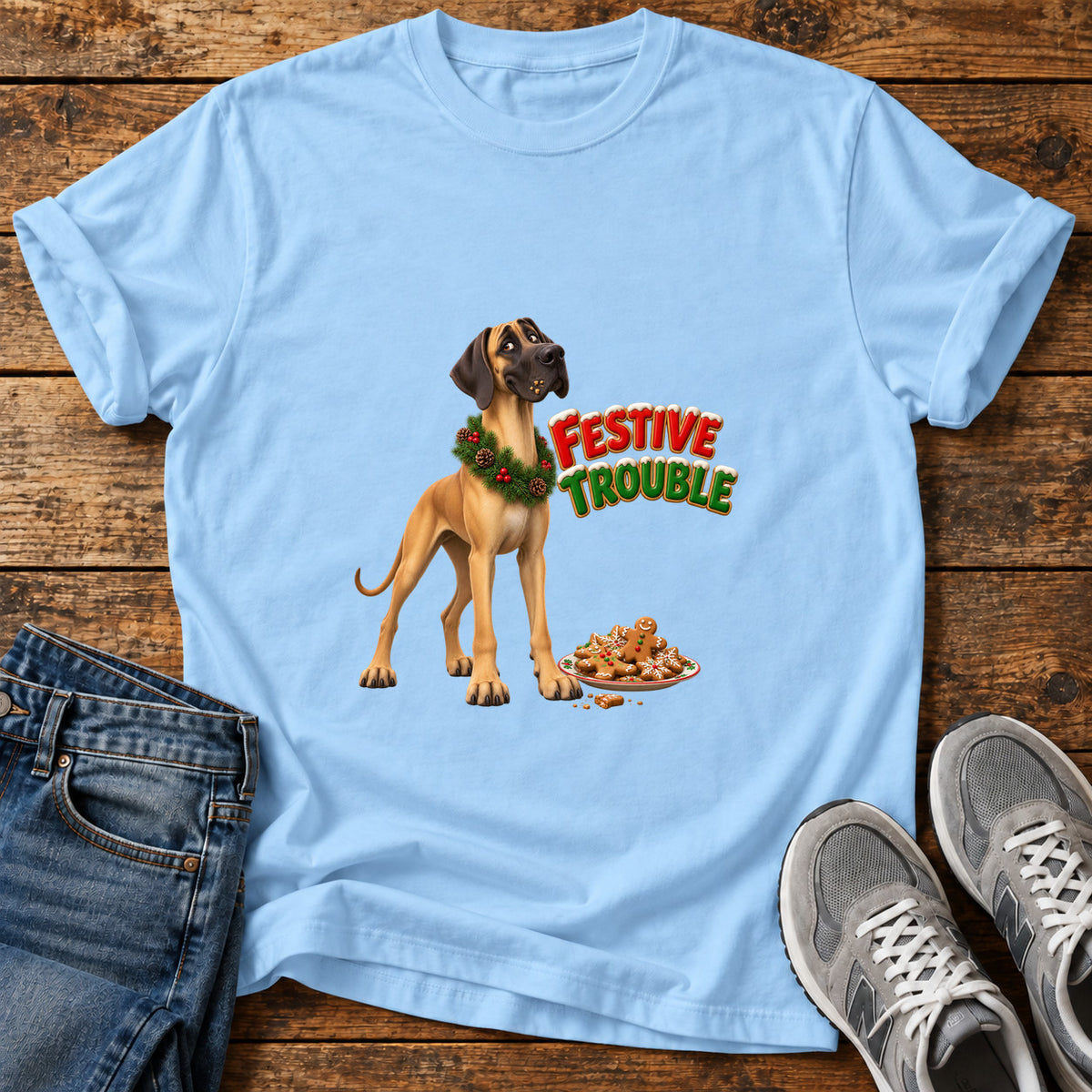 Festive Trouble Great Dane graphic T-shirt in Light Blue, shown on a flat-lay shirt mockup