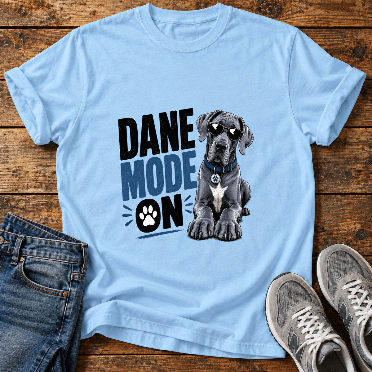 Dane Mode On Great Dane graphic T-shirt in Light Blue, shown on a flat-lay shirt mockup