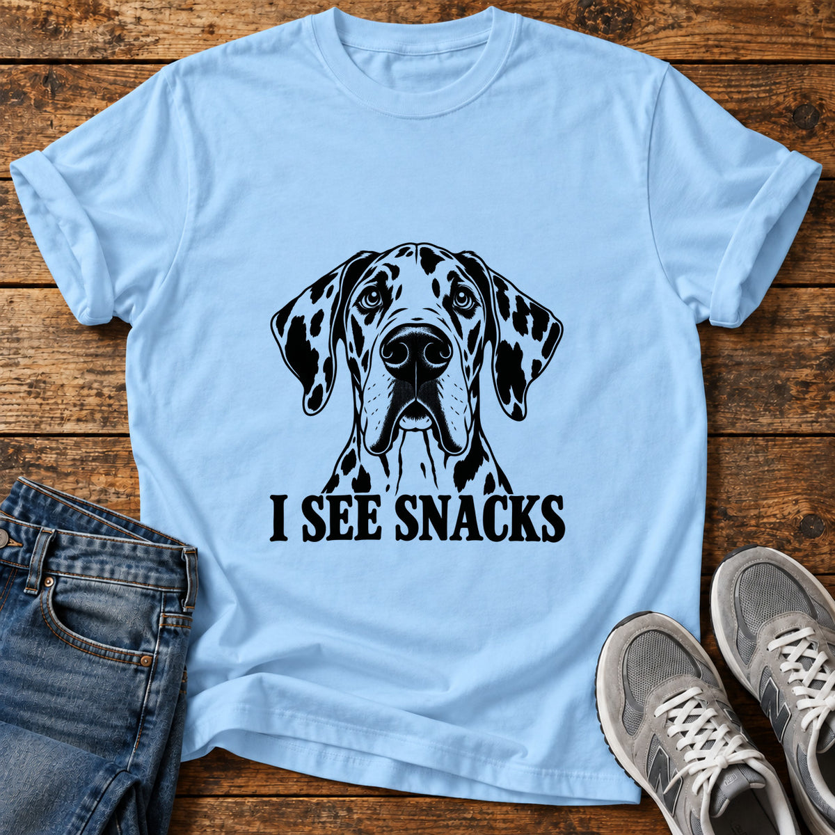 I See Snacks Great Dane graphic T-shirt in Light Blue, shown on a flat-lay shirt mockup