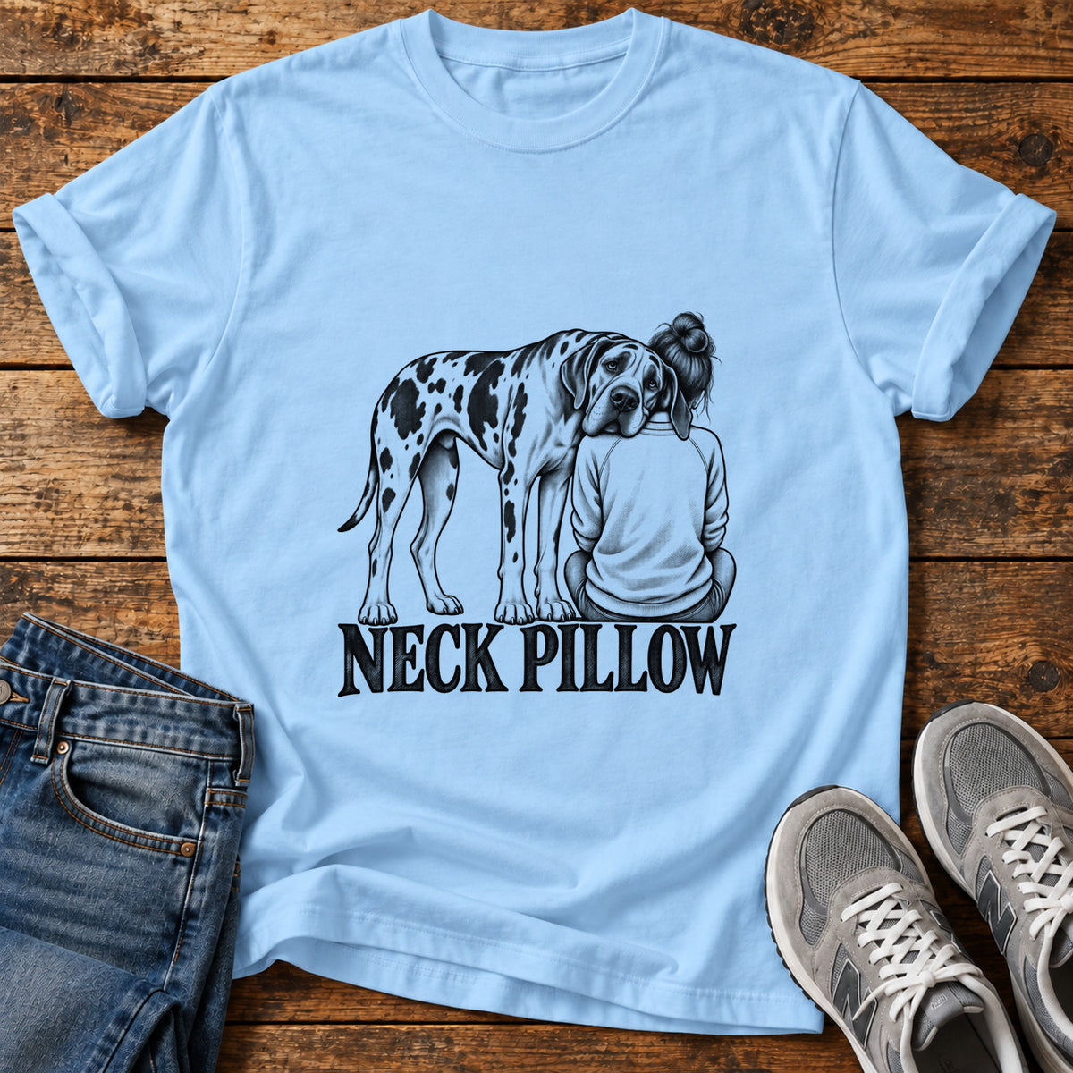 Neck Pillow Great Dane graphic T-shirt in Light Blue, shown on a flat-lay shirt mockup