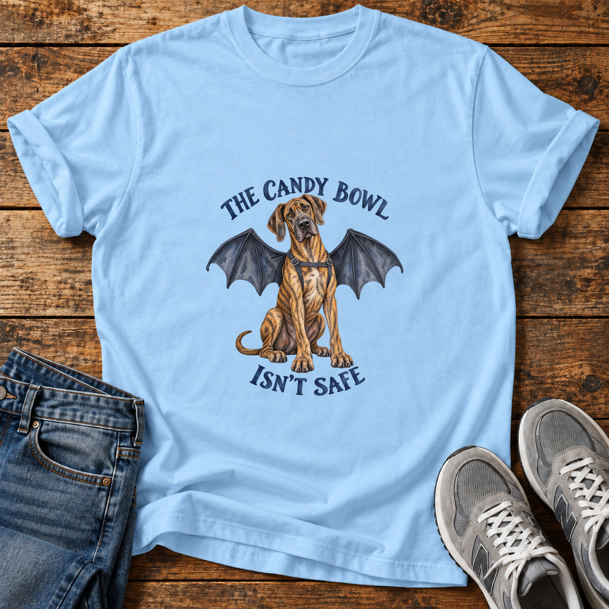 Candy Bowl Guardian Great Dane graphic T-shirt in Light Blue, shown on a flat-lay shirt mockup