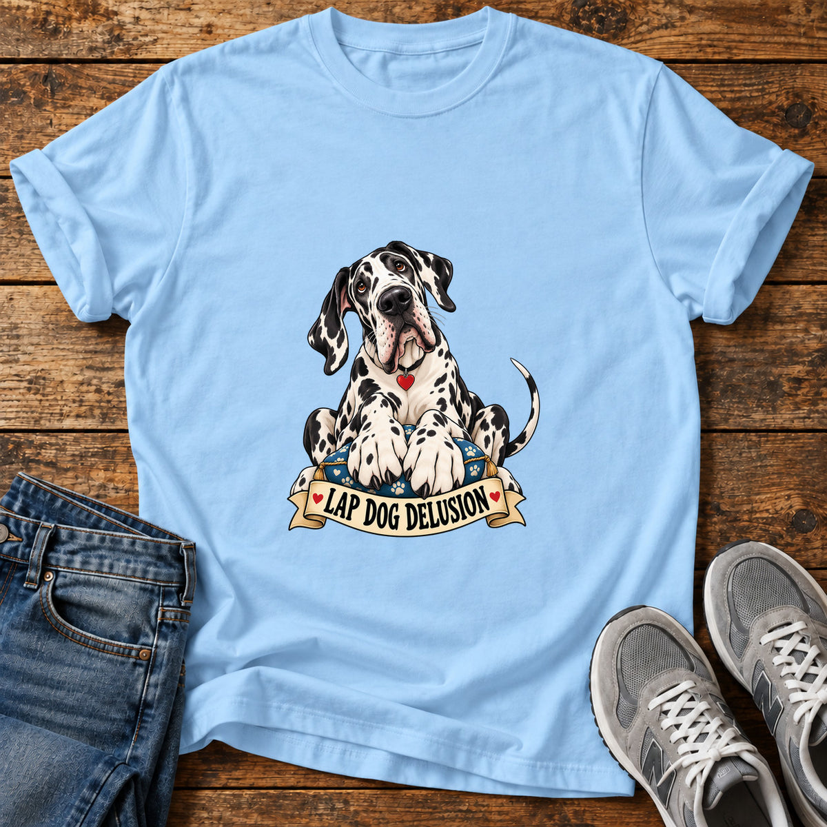 Lap Dog Delusion Great Dane graphic T-shirt in Light Blue, shown on a flat-lay shirt mockup