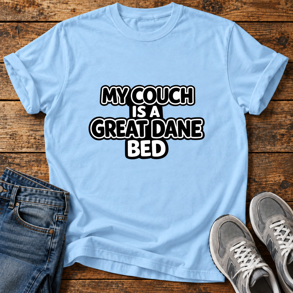 Great Dane Bed graphic T-shirt in Light Blue, shown on a flat-lay shirt mockup