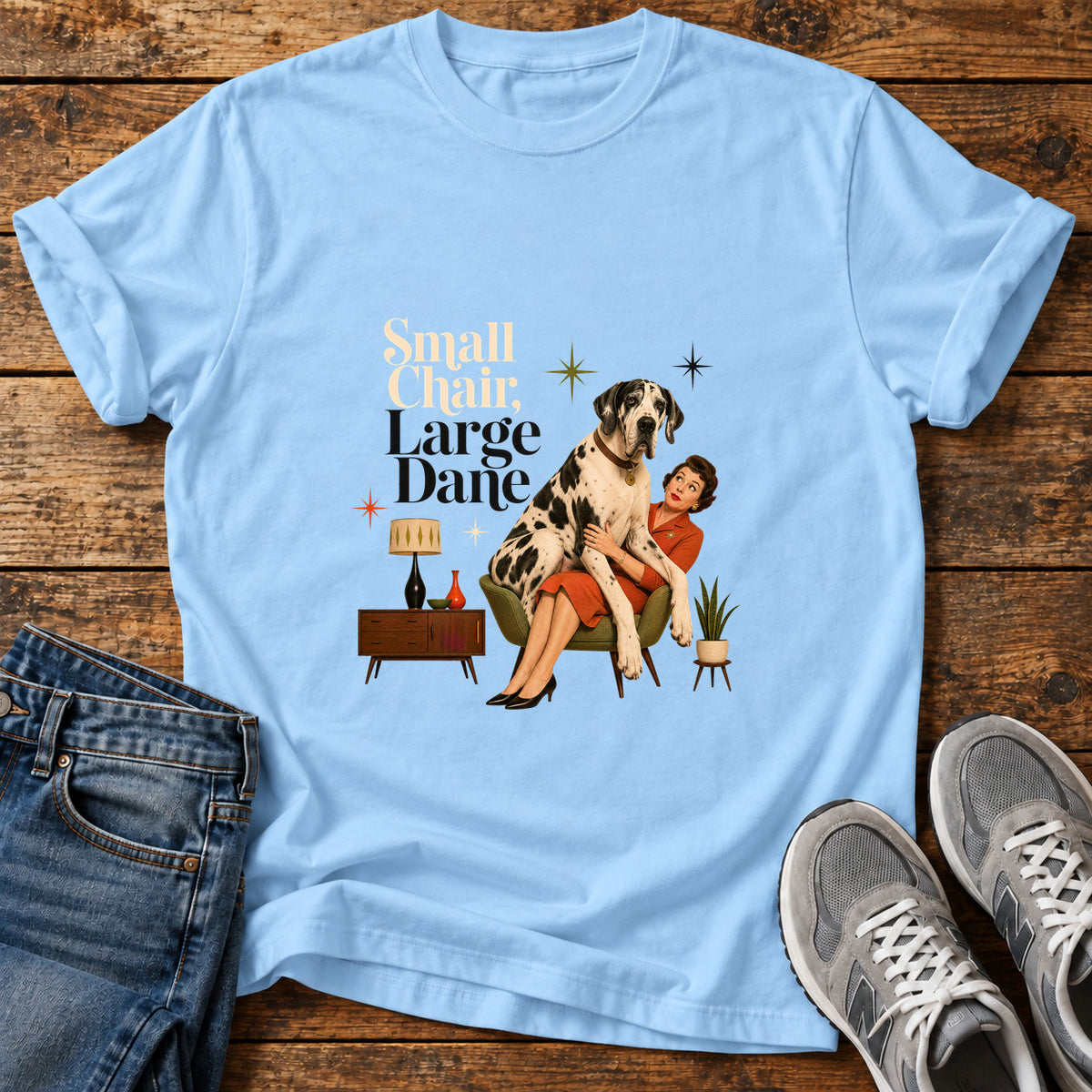 Small Chair Great Dane graphic T-shirt in Light Blue, shown on a flat-lay shirt mockup
