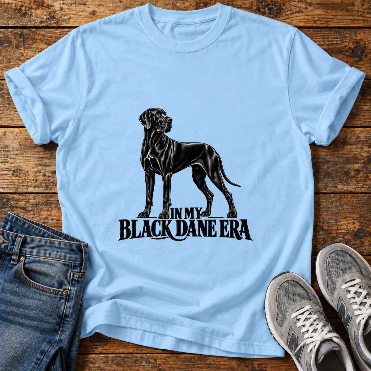 Black Dane Era Great Dane graphic T-shirt in Light Blue, shown on a flat-lay shirt mockup
