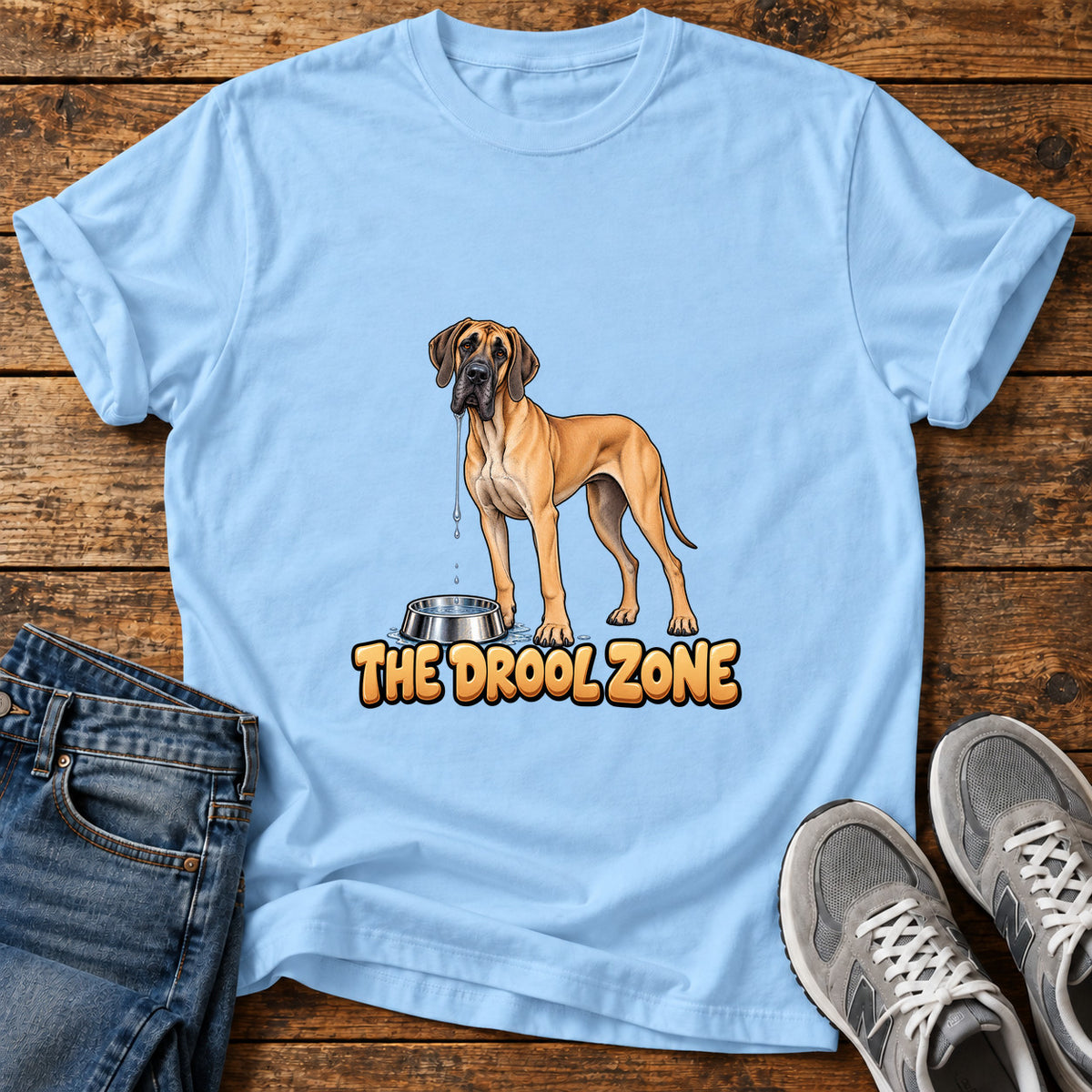 The Drool Zone Great Dane graphic T-shirt in Light Blue, shown on a flat-lay shirt mockup