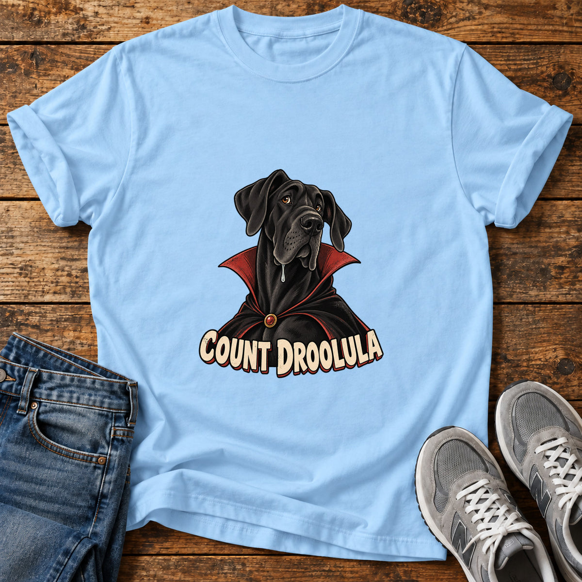 Count Droolula Great Dane graphic T-shirt in Light Blue, shown on a flat-lay shirt mockup