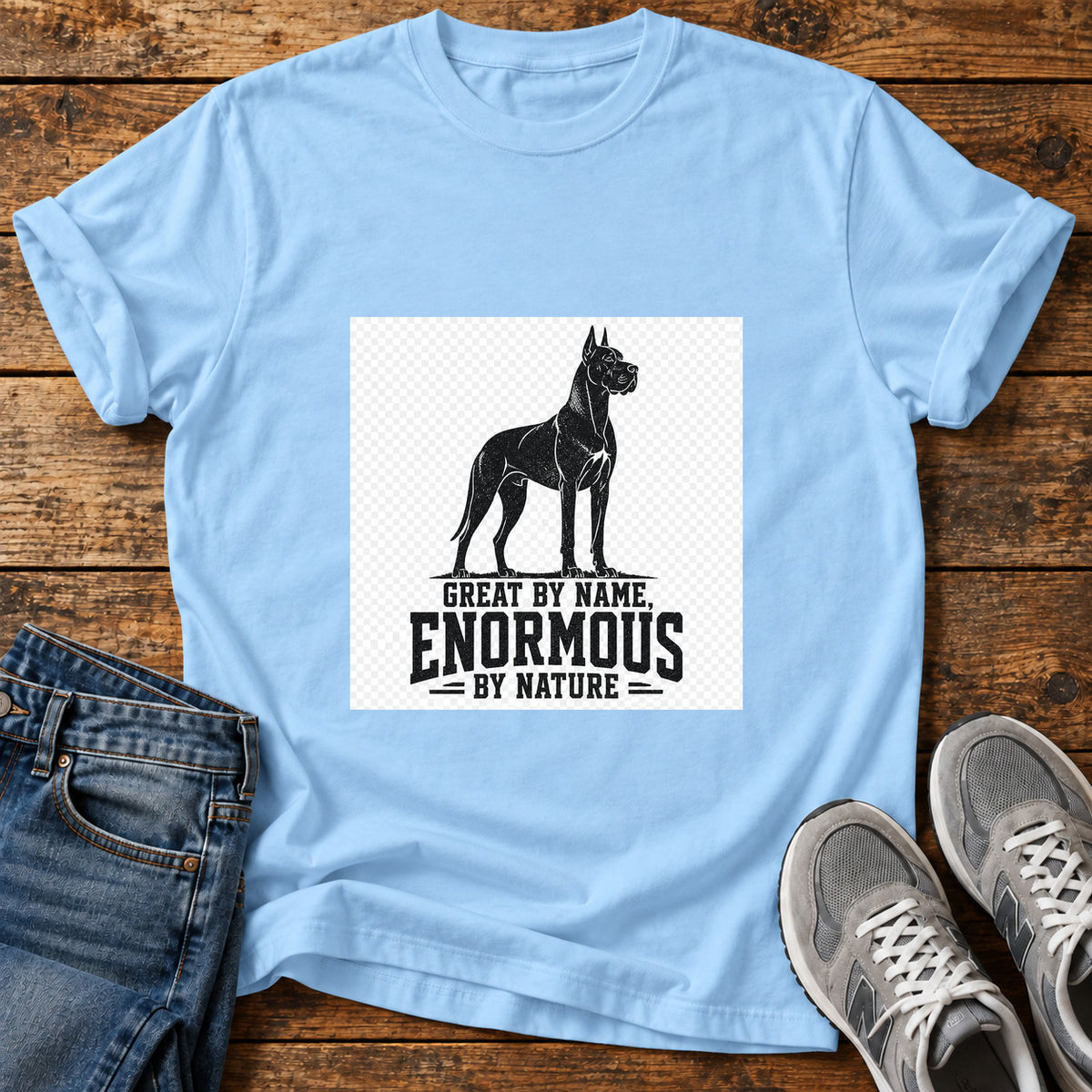 Enormous By Nature Great Dane graphic T-shirt in Light Blue, shown on a flat-lay shirt mockup