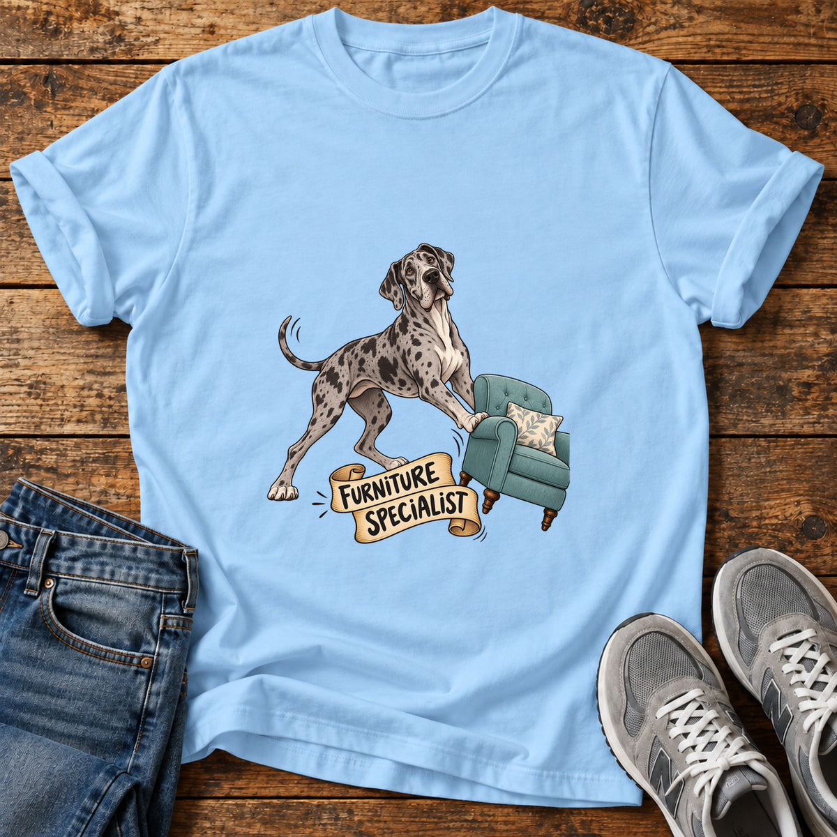 Furniture Specialist Great Dane graphic T-shirt in Light Blue, shown on a flat-lay shirt mockup