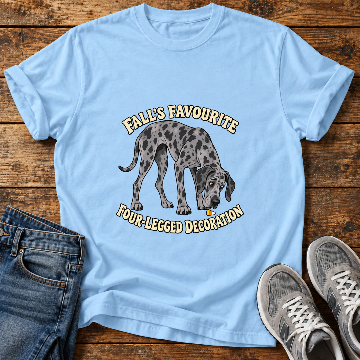Fall's Favorite Pooch Great Dane graphic T-shirt in Light Blue, shown on a flat-lay shirt mockup