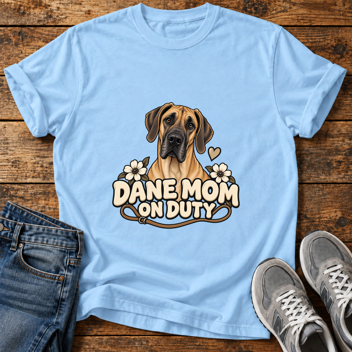 Dane Mom Duty Great Dane graphic T-shirt in Light Blue, shown on a flat-lay shirt mockup
