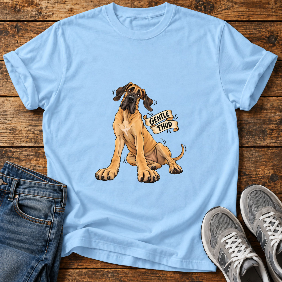 Gentle Thud Great Dane graphic T-shirt in Light Blue, shown on a flat-lay shirt mockup