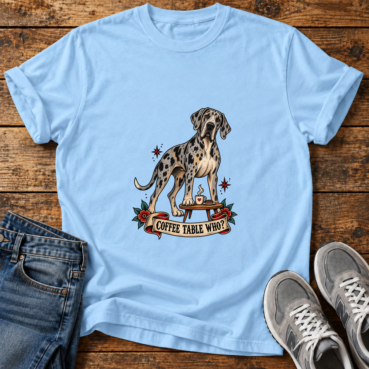 Coffee Table Who Great Dane graphic T-shirt in Light Blue, shown on a flat-lay shirt mockup