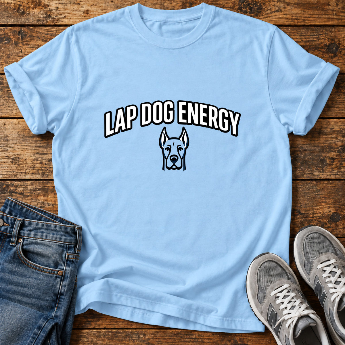 Lap Dog Energy Great Dane graphic T-shirt in Light Blue, shown on a flat-lay shirt mockup
