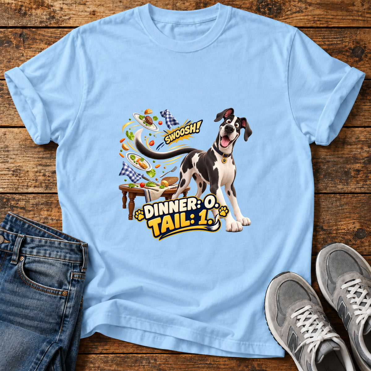 Dinner Tail Swoosh Great Dane graphic T-shirt in Light Blue, shown on a flat-lay shirt mockup