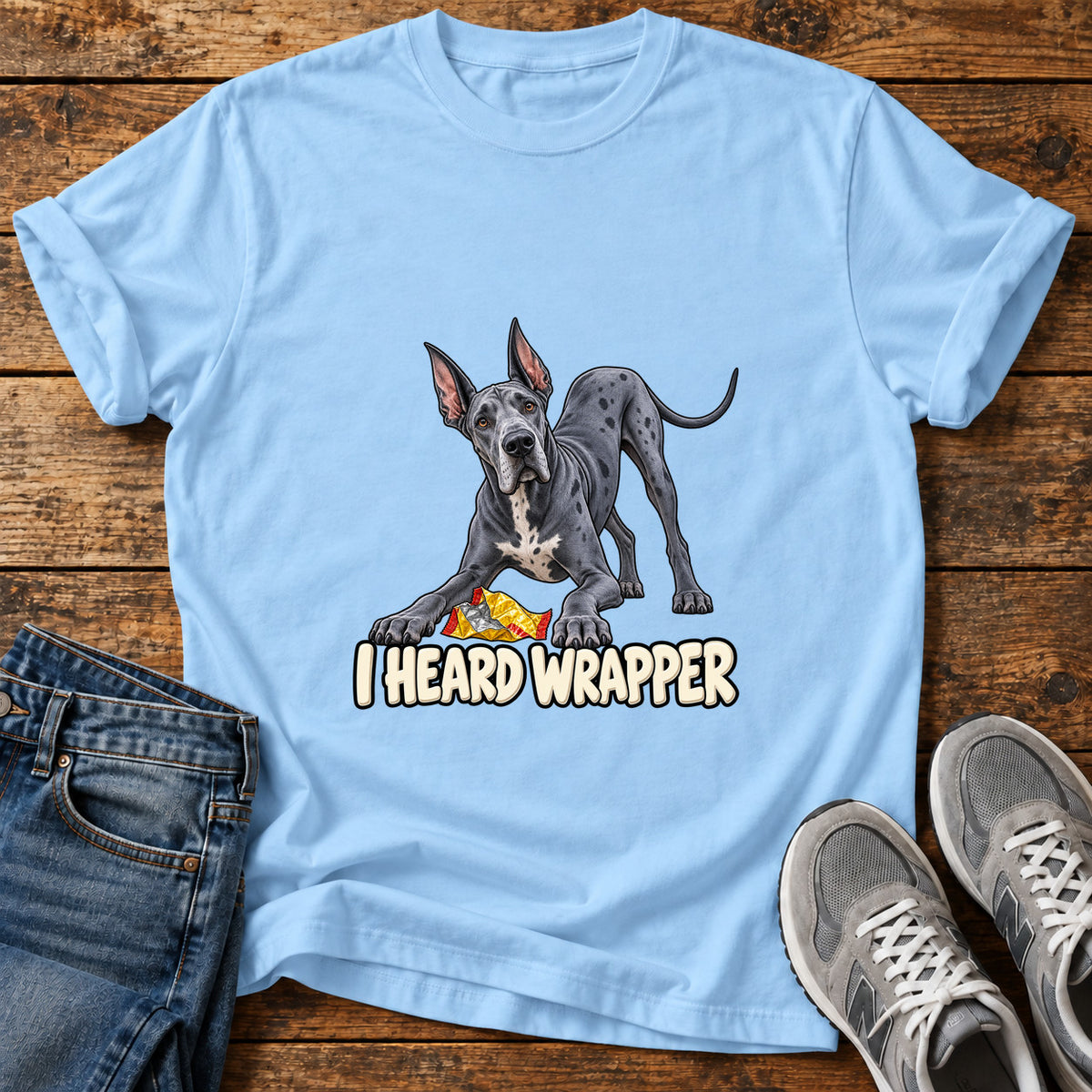 I Heard Wrapper Great Dane graphic T-shirt in Light Blue, shown on a flat-lay shirt mockup