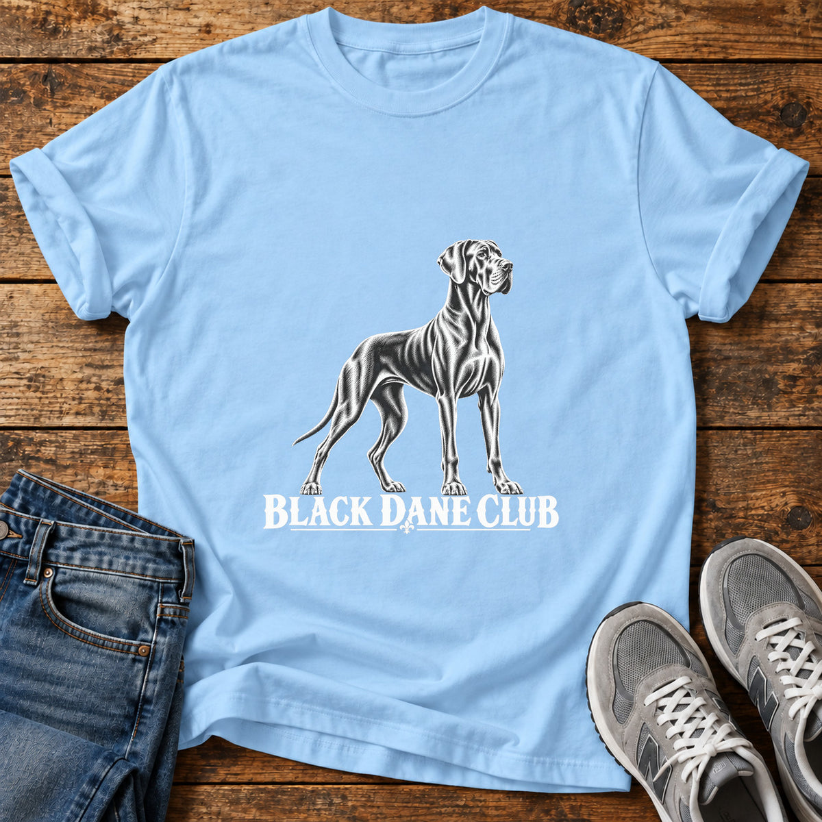 Black Dane Club Great Dane graphic T-shirt in Light Blue, shown on a flat-lay shirt mockup