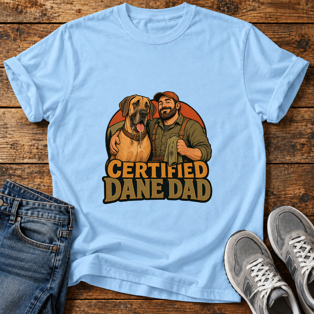 Certified Dane Dad Great Dane graphic T-shirt in Light Blue, shown on a flat-lay shirt mockup