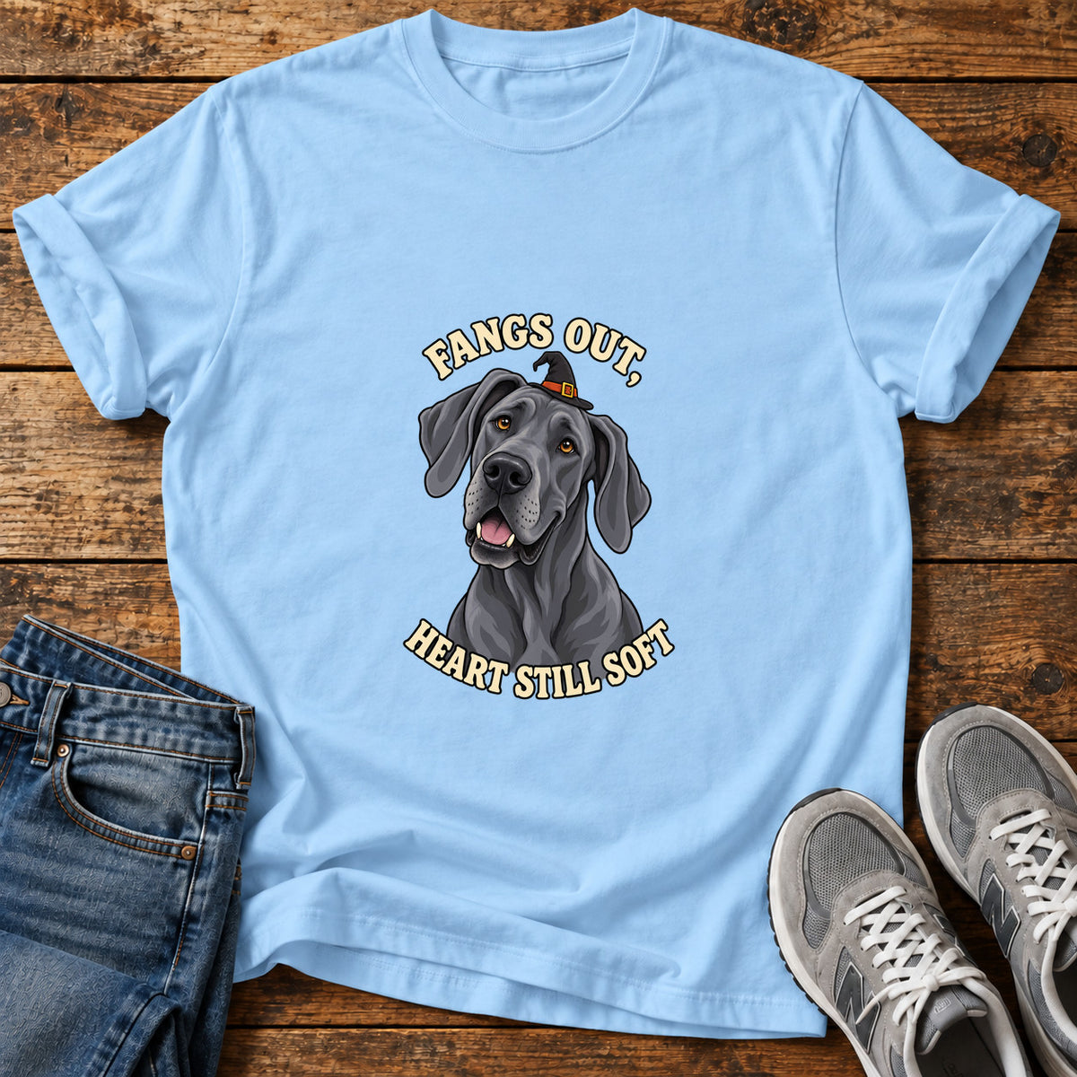 Fangs Out Great Dane graphic T-shirt in Light Blue, shown on a flat-lay shirt mockup
