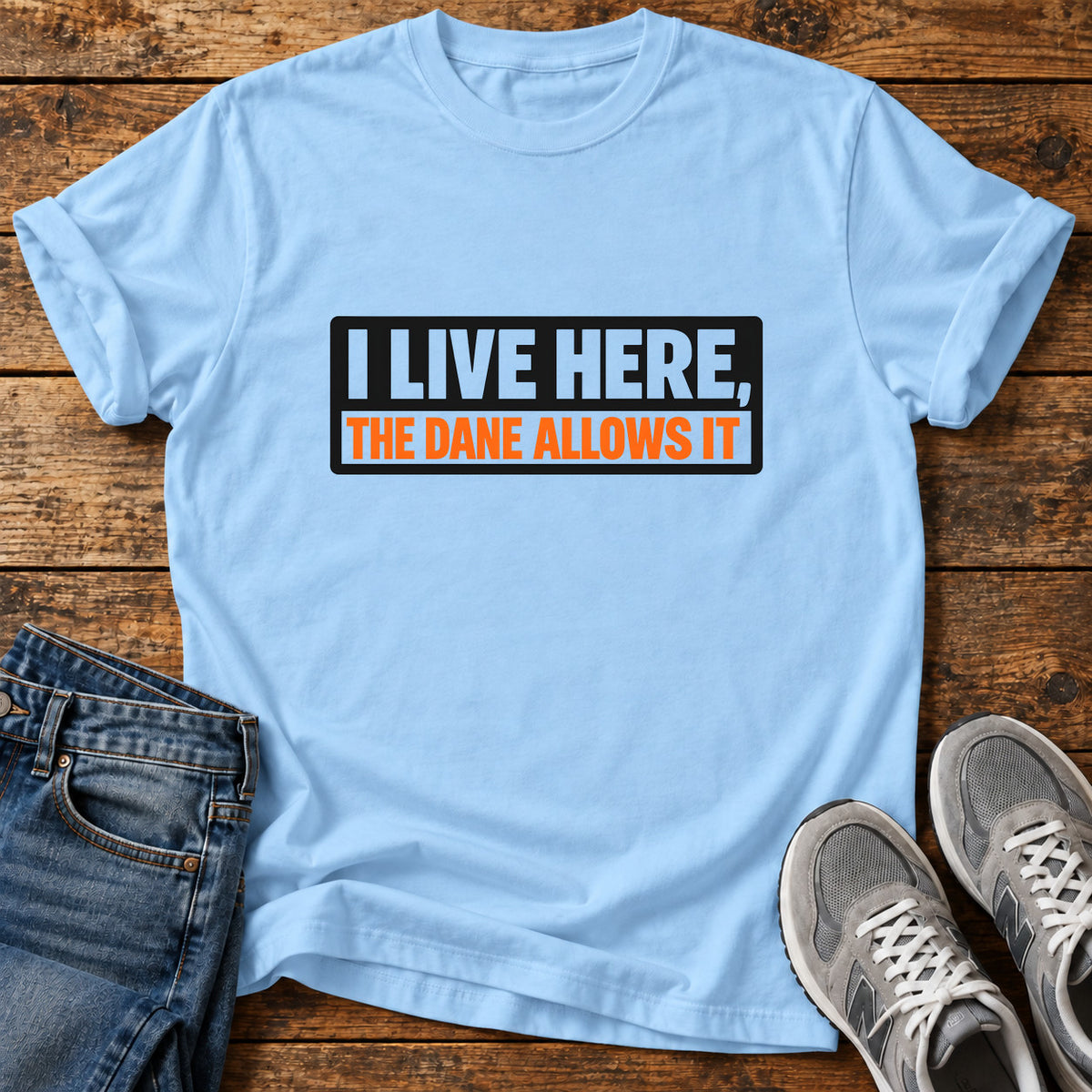 Live Here Dane Great Dane graphic T-shirt in Light Blue, shown on a flat-lay shirt mockup