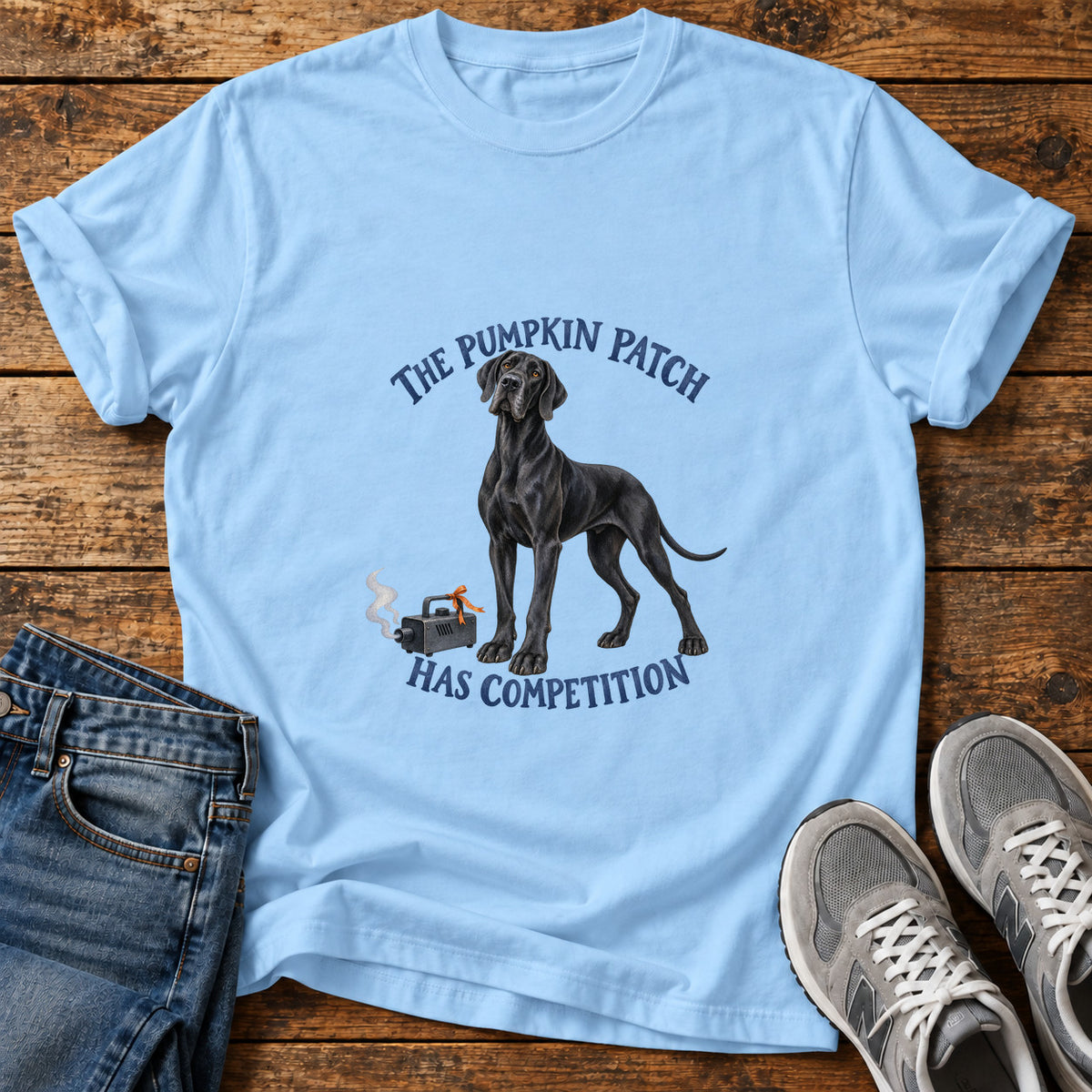 The Pumpkin Competition Great Dane graphic T-shirt in Light Blue, shown on a flat-lay shirt mockup