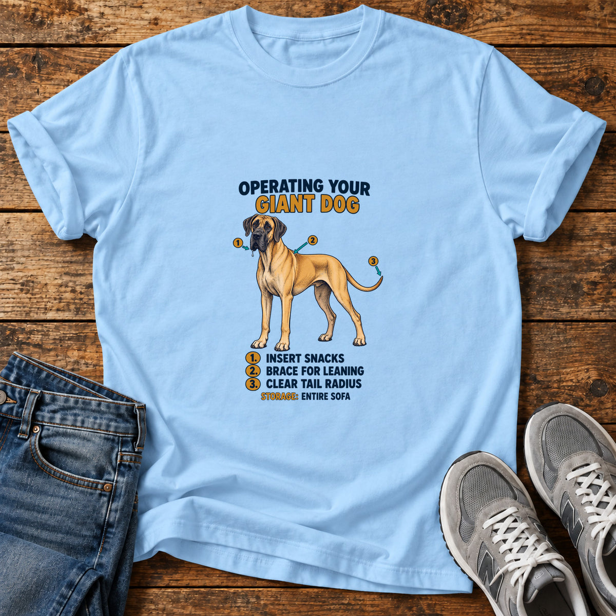 Giant Dog Guide Great Dane graphic T-shirt in Light Blue, shown on a flat-lay shirt mockup