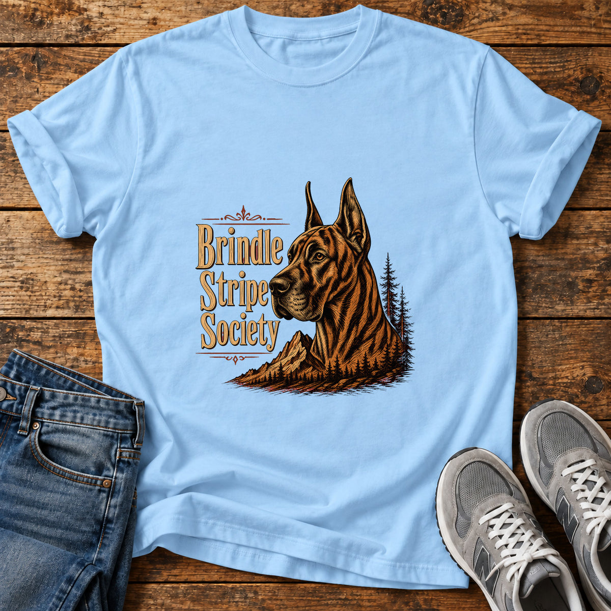Brindle Stripe Society Great Dane graphic T-shirt in Light Blue, shown on a flat-lay shirt mockup