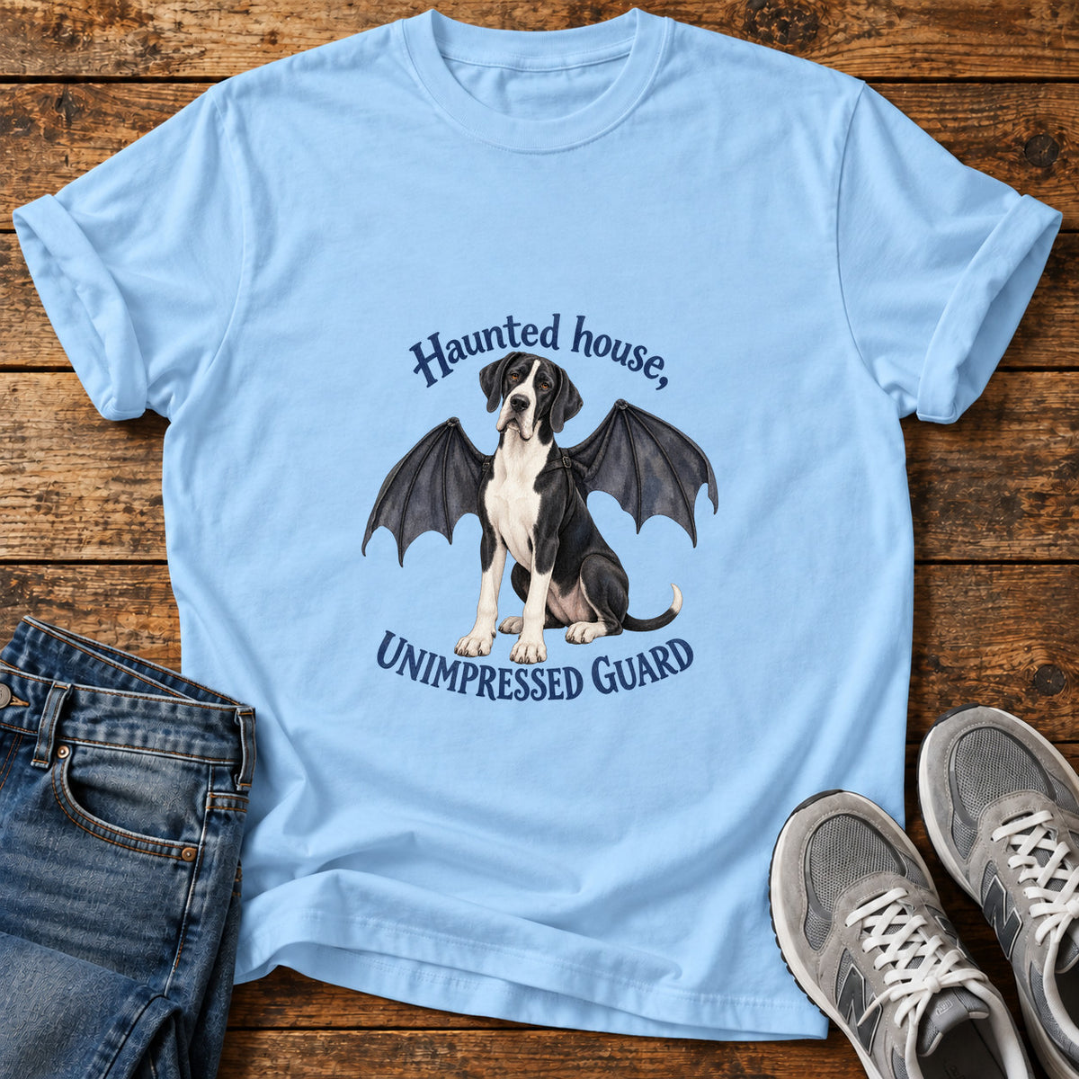 Unimpressed Guard Great Dane graphic T-shirt in Light Blue, shown on a flat-lay shirt mockup