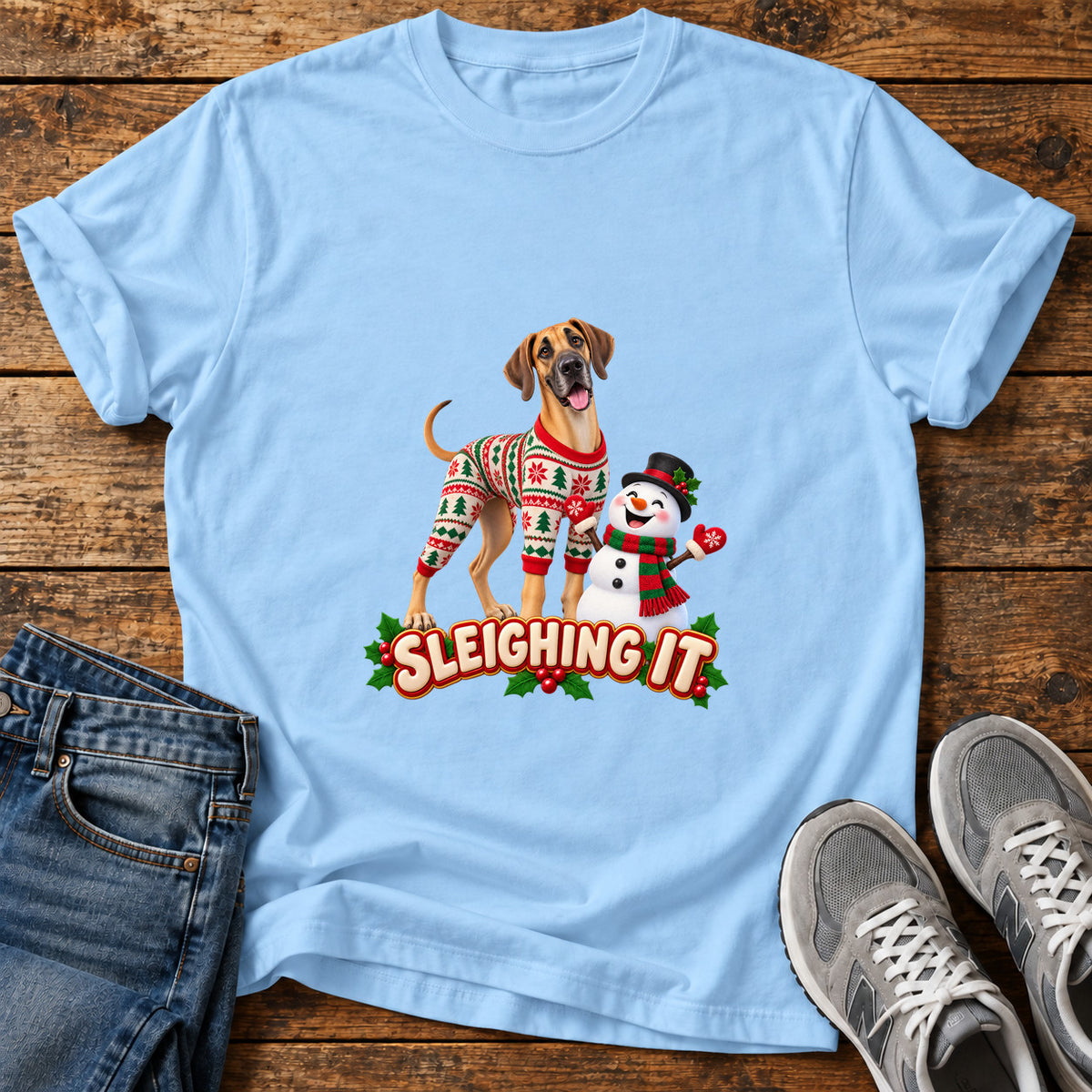 Sleighing It Great Dane graphic T-shirt in Light Blue, shown on a flat-lay shirt mockup