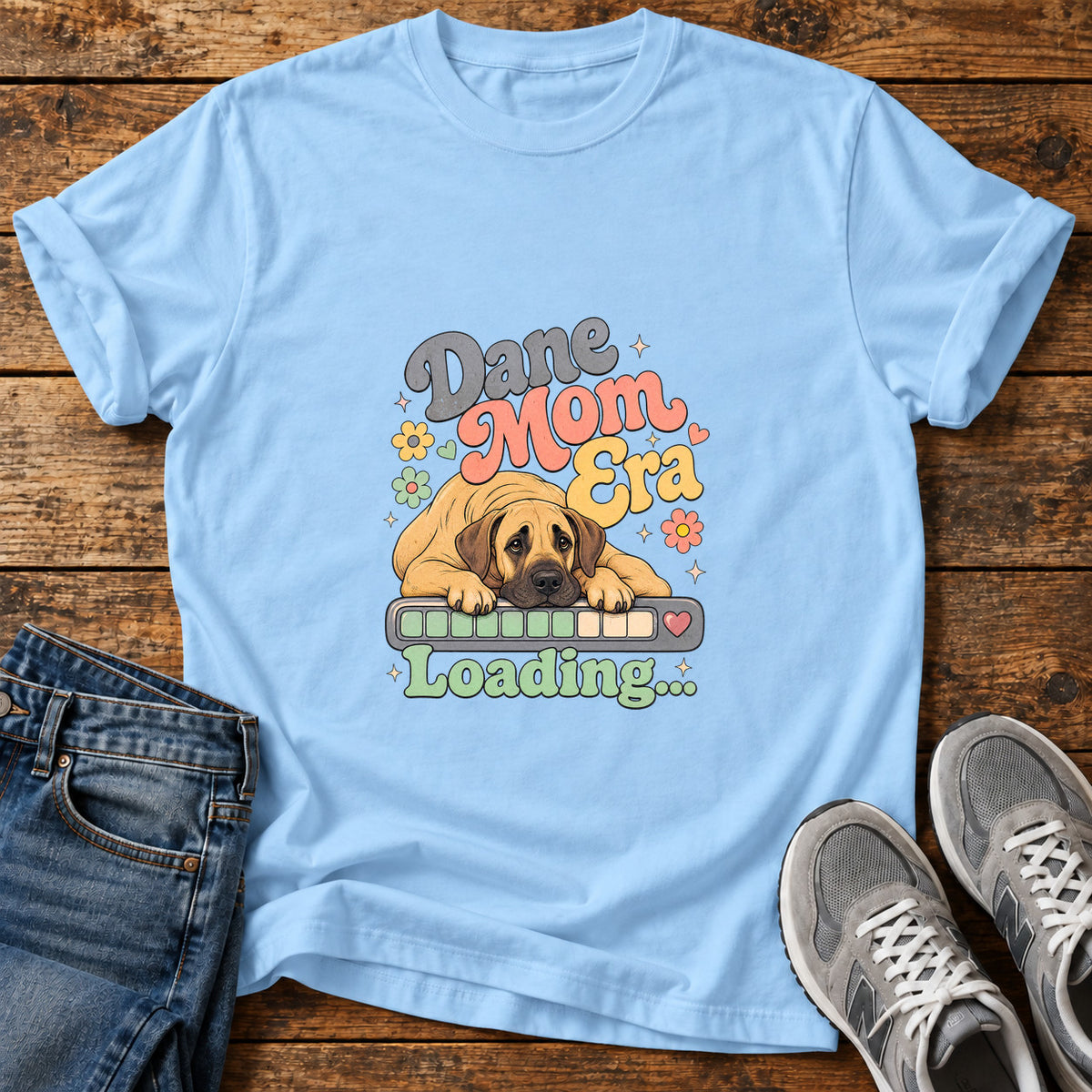 Dane Mom Loading Great Dane graphic T-shirt in Light Blue, shown on a flat-lay shirt mockup