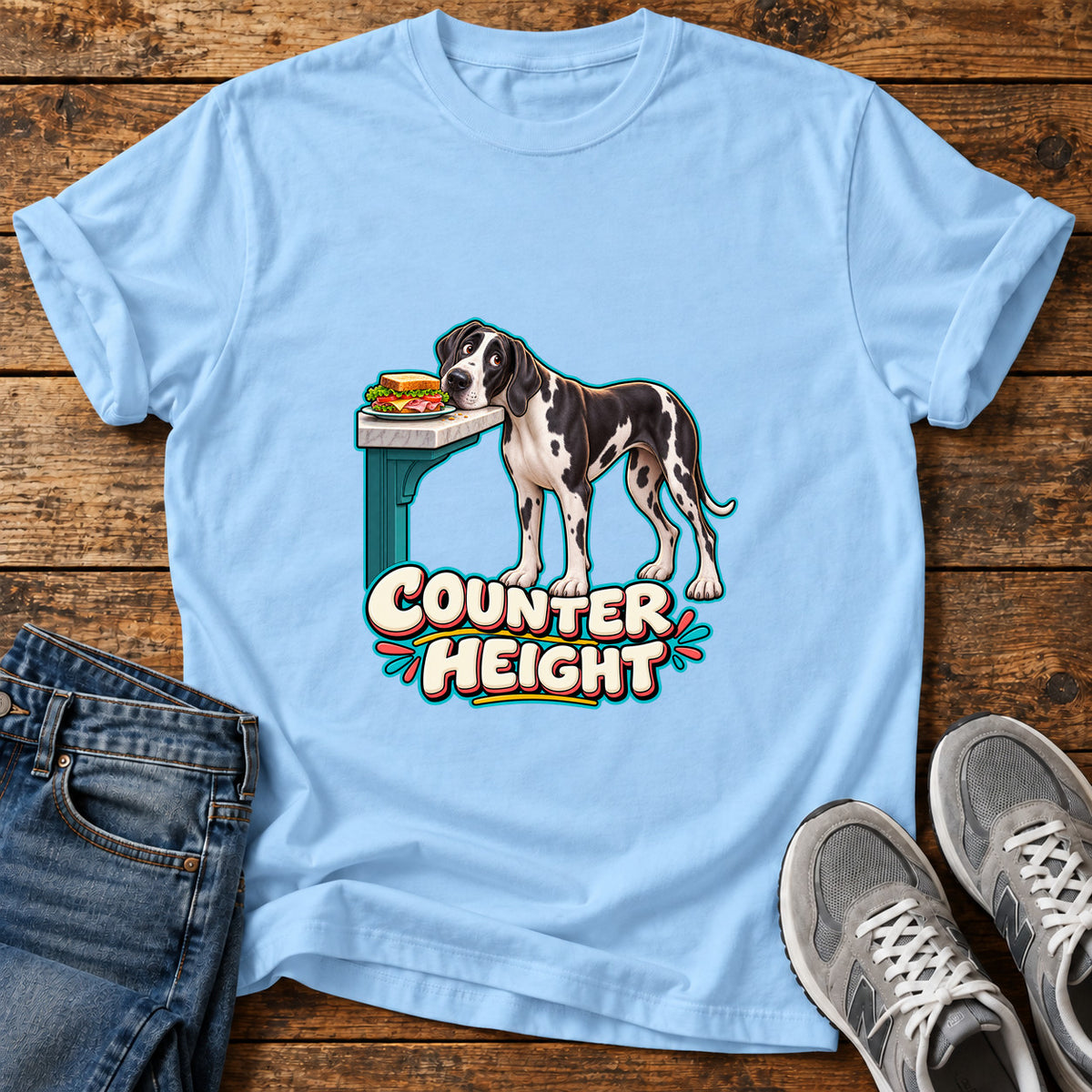 Counter Height Great Dane graphic T-shirt in Light Blue, shown on a flat-lay shirt mockup