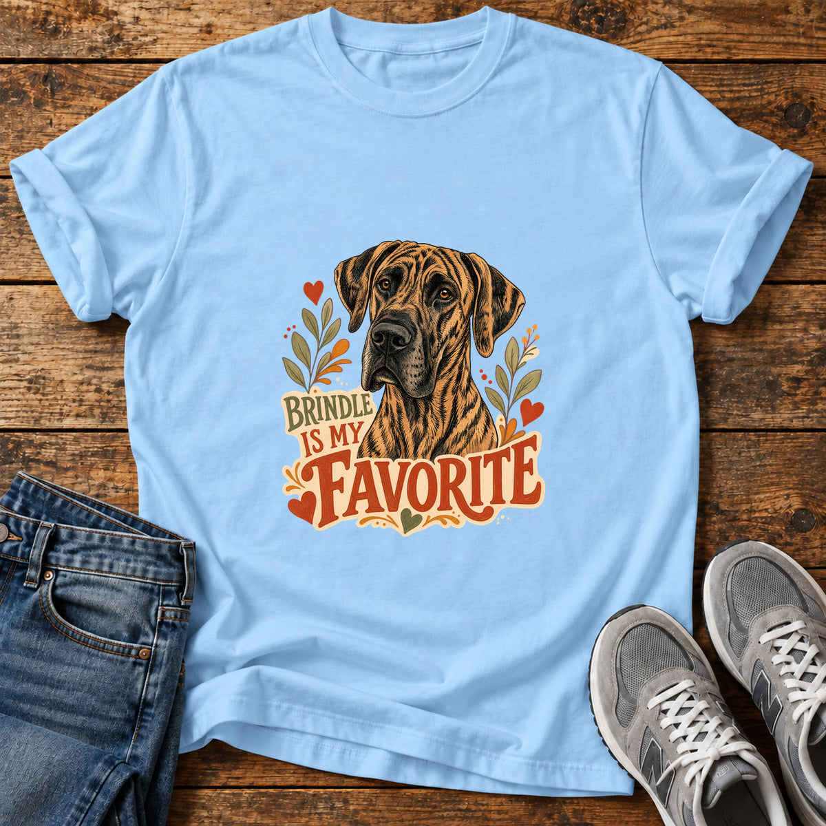 Brindle Favorite Great Dane graphic T-shirt in Light Blue, shown on a flat-lay shirt mockup