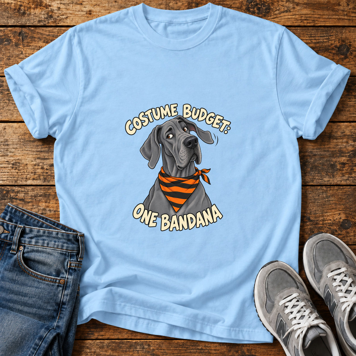 Costume Budget Great Dane graphic T-shirt in Light Blue, shown on a flat-lay shirt mockup