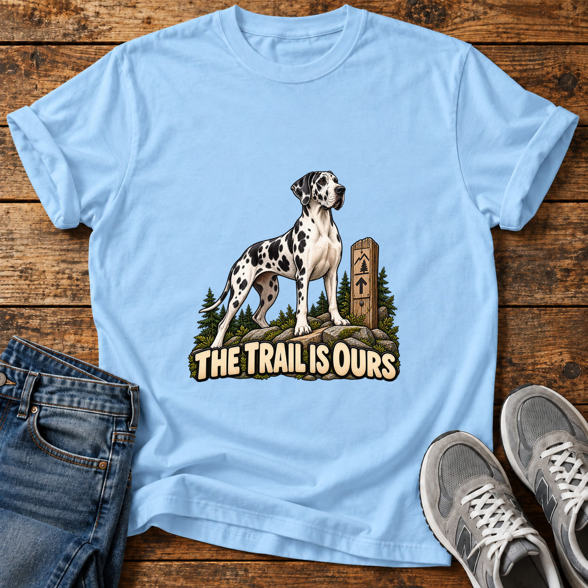 Trail Is Ours Great Dane graphic T-shirt in Light Blue, shown on a flat-lay shirt mockup