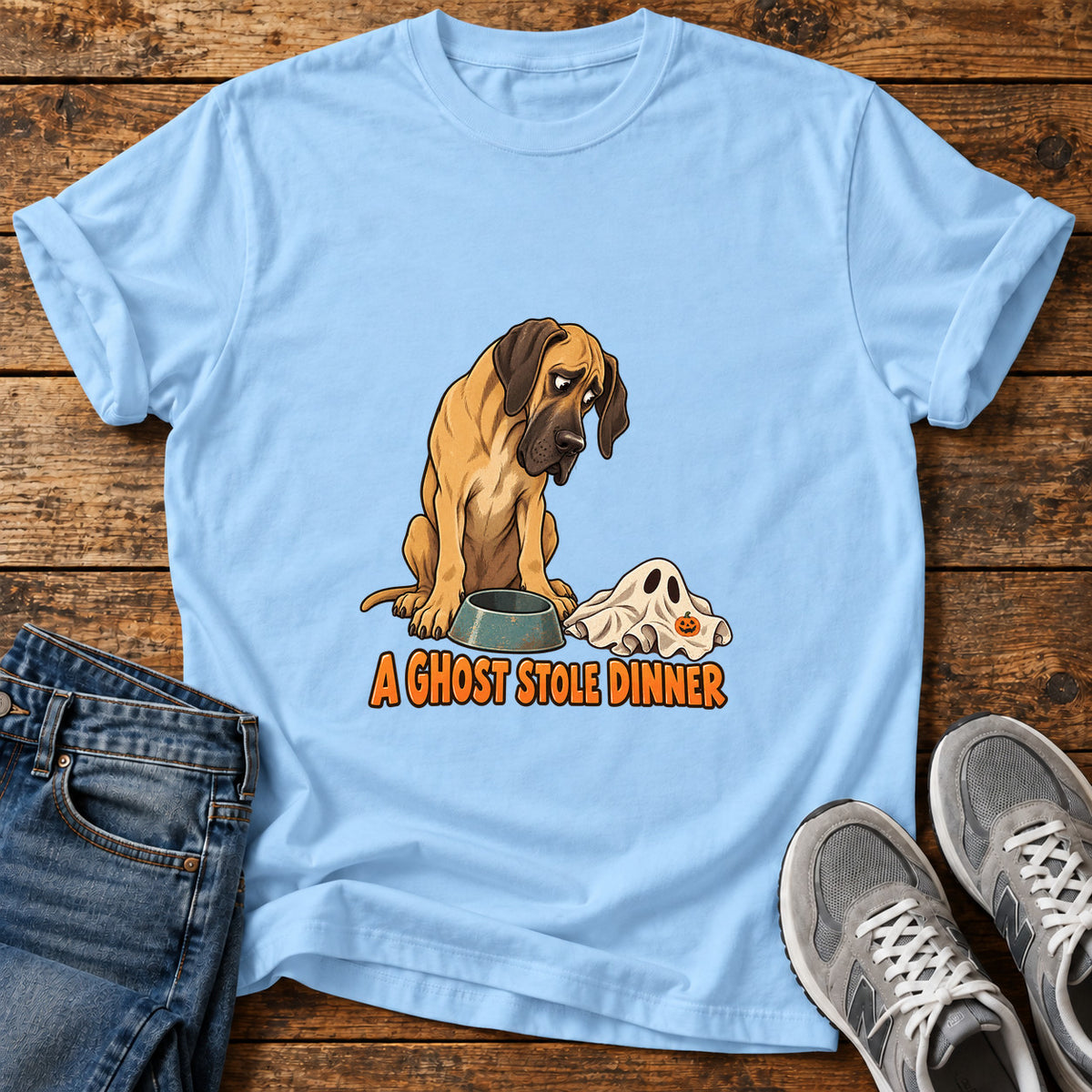 A Ghost Dinner Great Dane graphic T-shirt in Light Blue, shown on a flat-lay shirt mockup