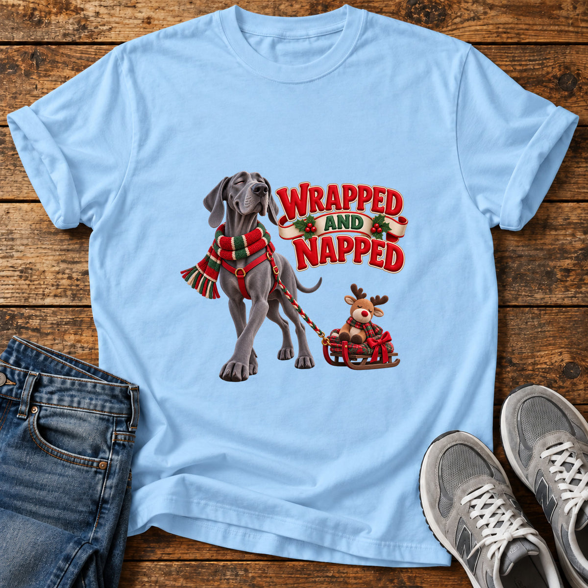 Wrapped And Napped Great Dane graphic T-shirt in Light Blue, shown on a flat-lay shirt mockup