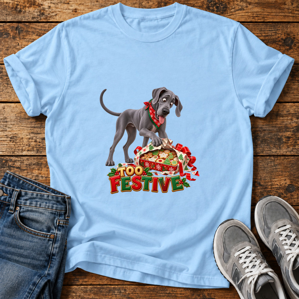 Too Festive Great Dane graphic T-shirt in Light Blue, shown on a flat-lay shirt mockup
