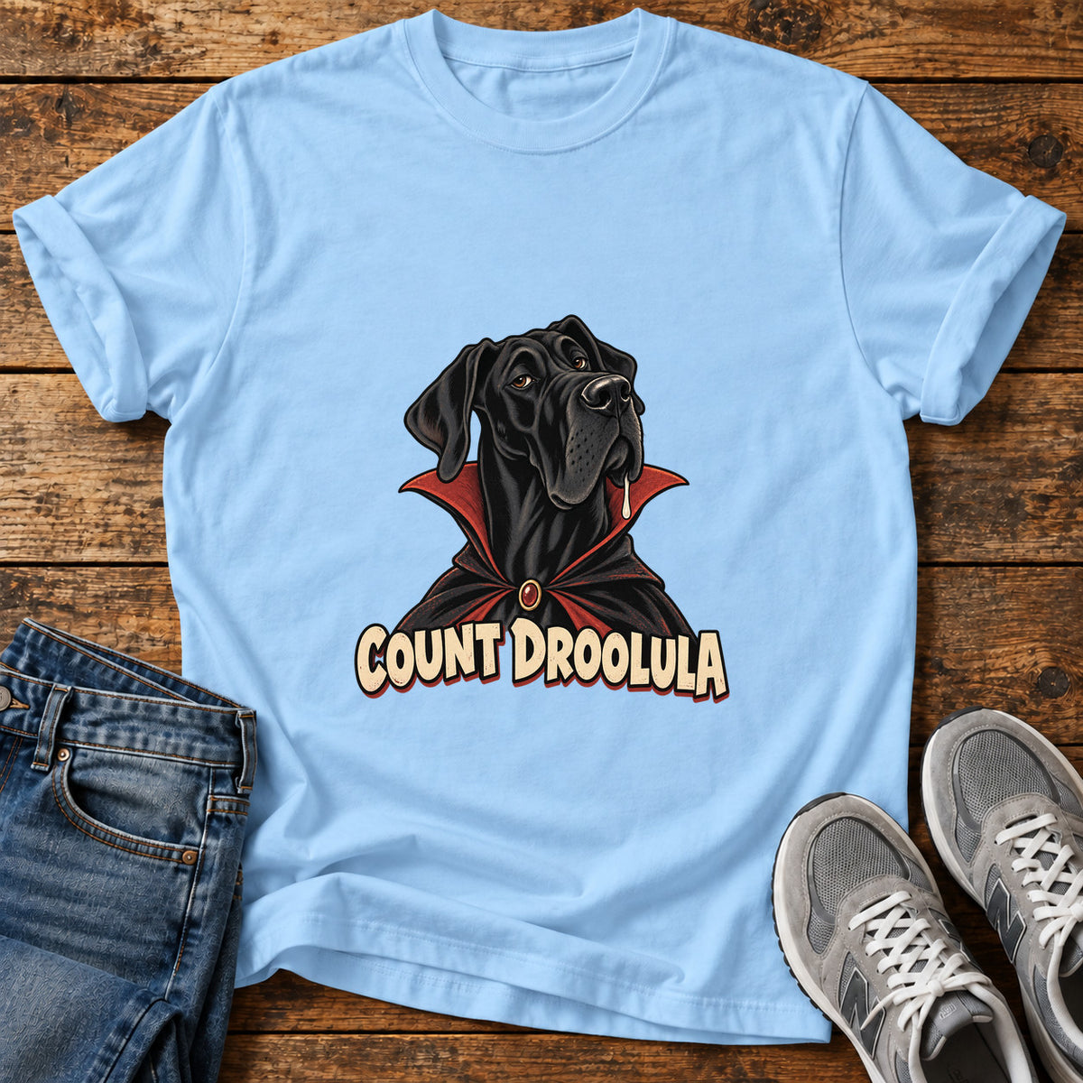 Count Droolula Great Dane graphic T-shirt in Light Blue, shown on a flat-lay shirt mockup