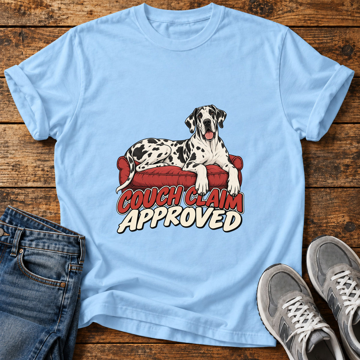 Couch Claim Great Dane graphic T-shirt in Light Blue, shown on a flat-lay shirt mockup