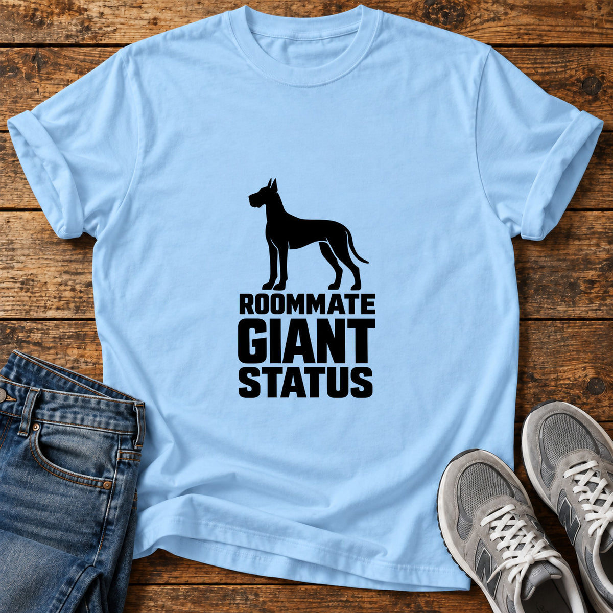 Roommate Giant Status Great Dane graphic T-shirt in Light Blue, shown on a flat-lay shirt mockup